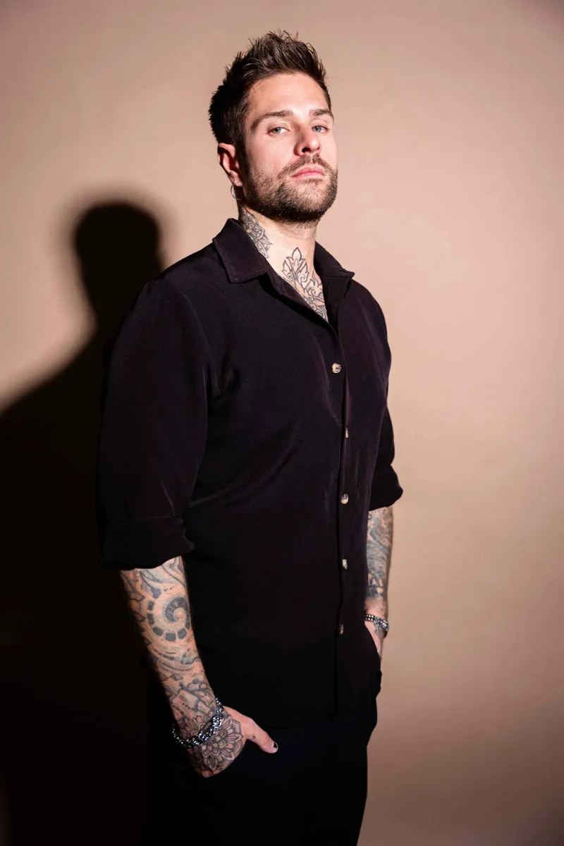 Studio portrait of Rafael Cerato in a black shirt